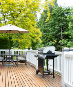 Outdoor Living Space with Deck, Grill, and Patio Furniture: Houston Landscaping