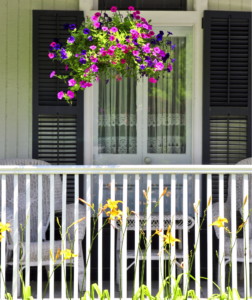 Charming Front Porch with Colorful Flowers: Houston Landscaping