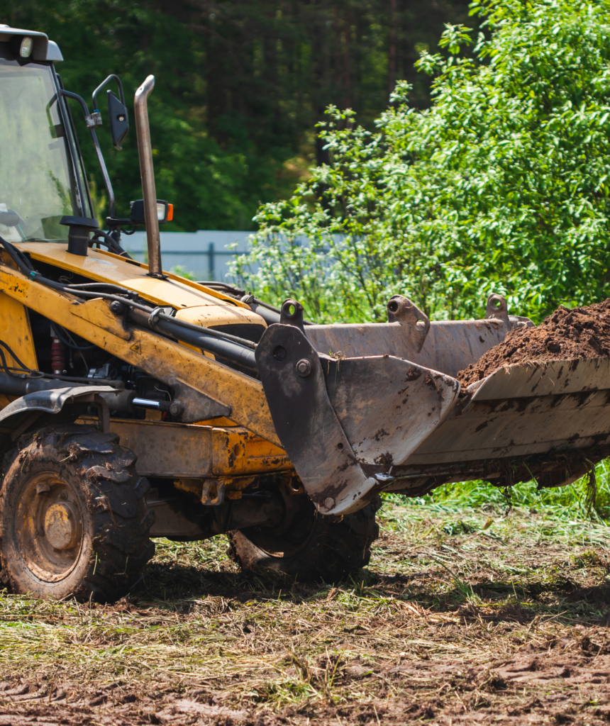 Heavy Machinery Digging and Grading Land for Construction