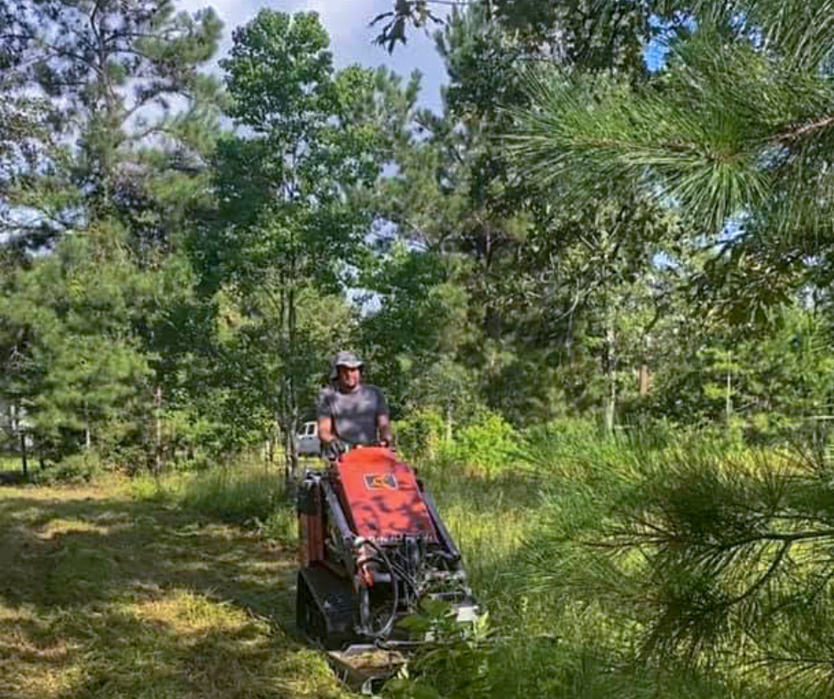 Landscaper Using a Brush Hog to Clear Overgrown Vegetation